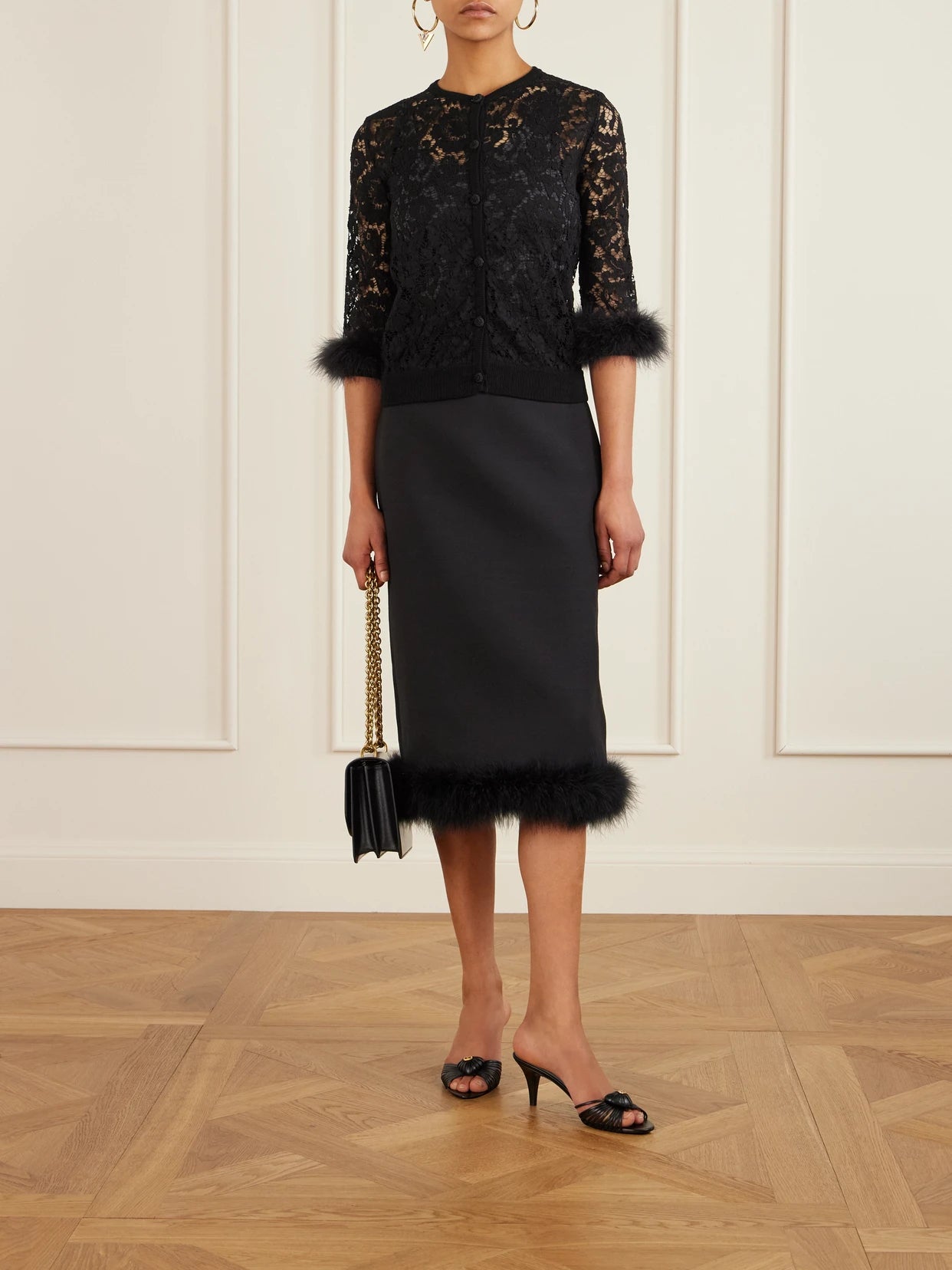 Image of a model wearing Outerwear. Product name - Feather-trimmed Cotton Corded Lace Cardigan in Black colour by brand - Valentino Garavani