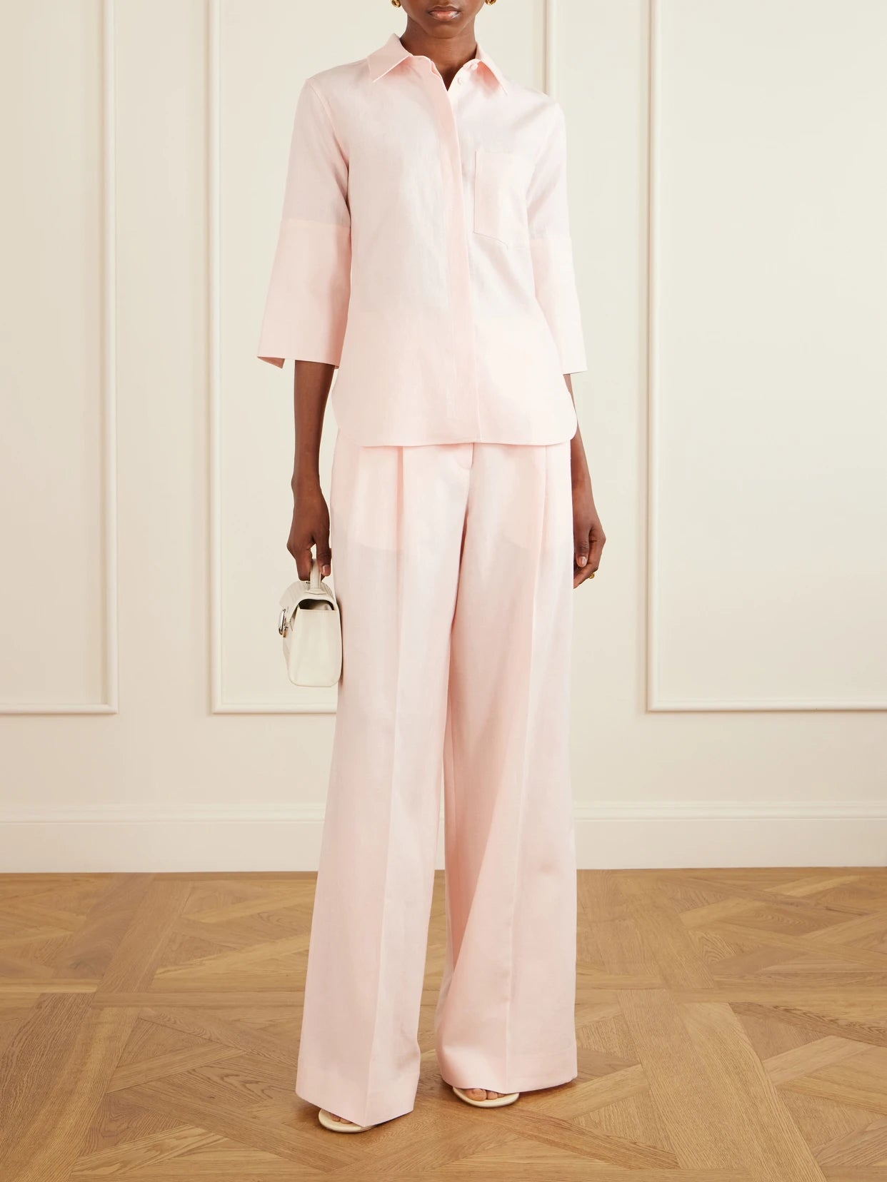 Image of a model wearing Tops. Product name - Linen-canvas Shirt in Pastel pink colour by brand - Another Tomorrow
