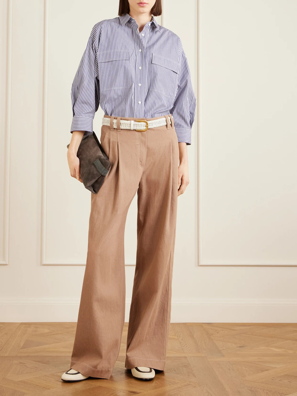 Image of a model wearing Tops. Product name - Striped Cotton-poplin Shirt in Blue colour by brand - Brunello Cucinelli