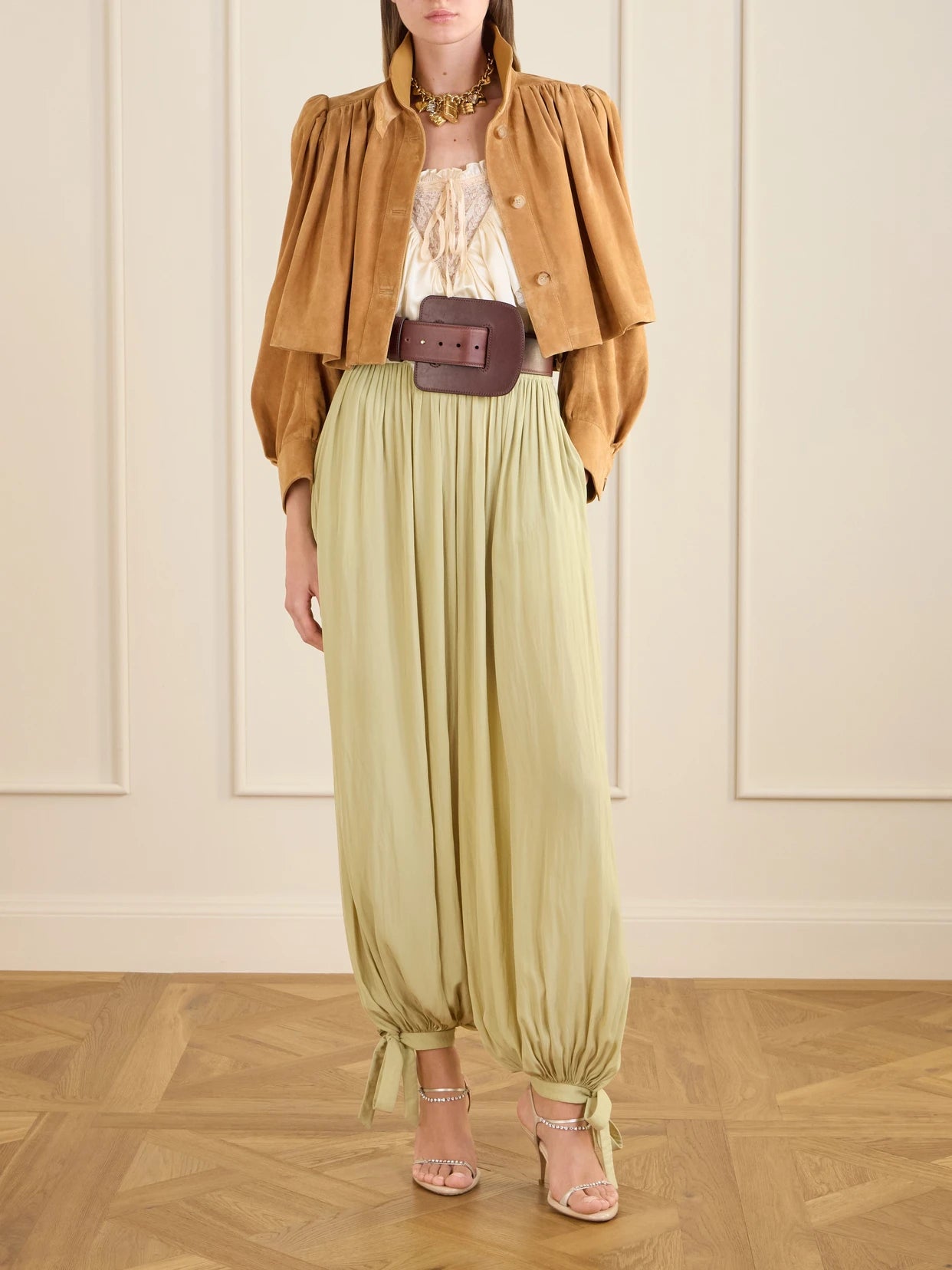 Image of a model wearing Pants. Product name - Satin Tapered Pants in Light green colour by brand - Chloé