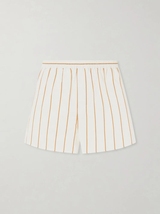 Image of a model wearing Shorts. Product name - Rove Striped Cotton-blend Shorts in Off-white colour by brand - STAUD