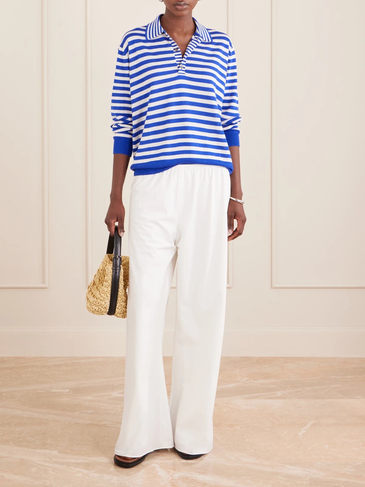 Image of a model wearing Pants. Product name - Colby Cotton-poplin Wide-leg Pants in White colour by brand - La Ligne