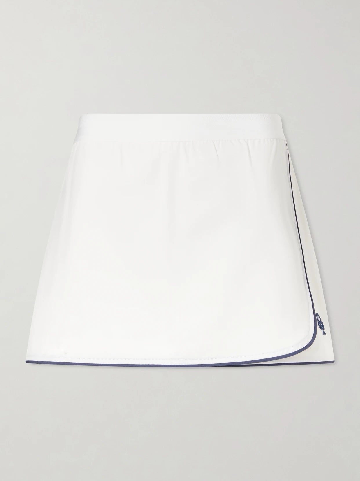 Image of a model wearing Tops. Product name - Anaya Jersey Skort in White colour by brand - Varley