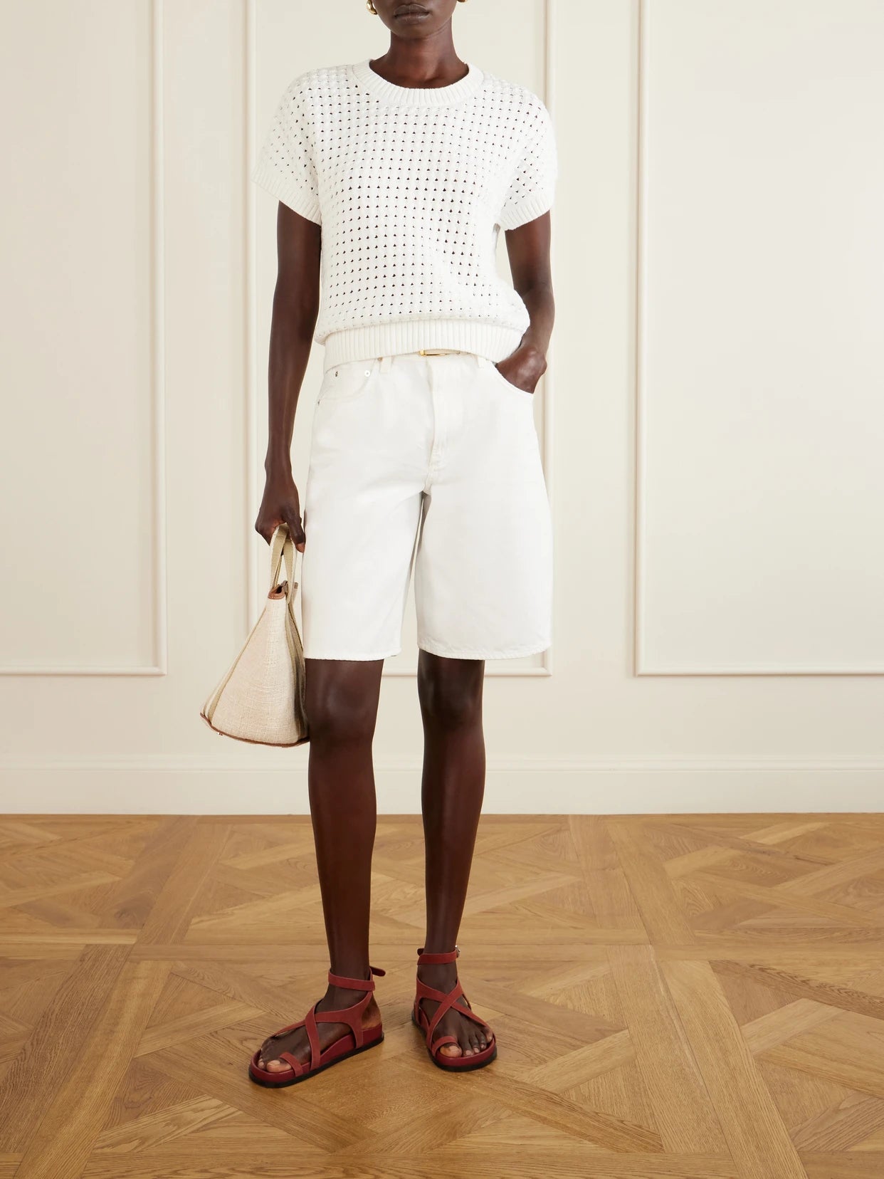 Image of a model wearing Outerwear. Product name - Denny Open-knit Cotton-blend T-shirt in White colour by brand - Varley