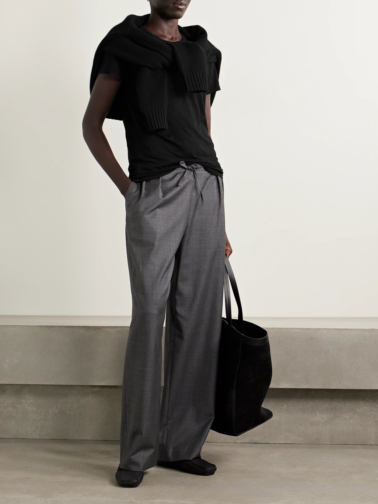 Image of a model wearing Tops. Product name - Lana Cotton-jersey T-shirt in Black colour by brand - Nili Lotan