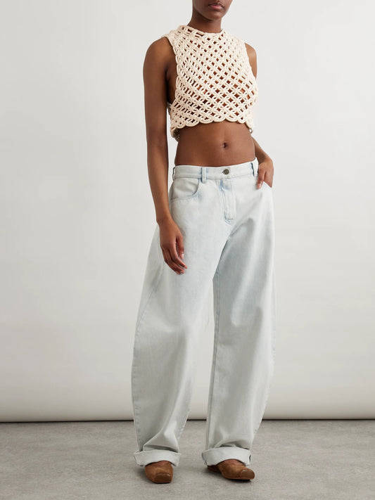 Image of a model wearing Tops. Product name - Cropped Open-knit Cotton-blend Tank in Neutral colour by brand - Alaïa