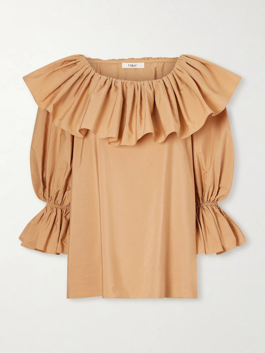 Image of a model wearing Tops. Product name - Ruffled Cotton-poplin Top in Beige colour by brand - Chloé