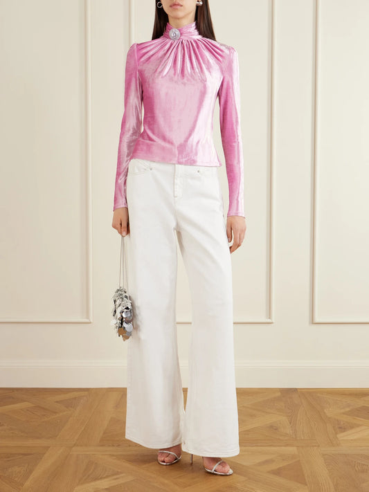 Image of a model wearing Tops. Product name - Crystal-embellished Gathered Velvet Turtleneck Blouse in Bright pink colour by brand - RABANNE