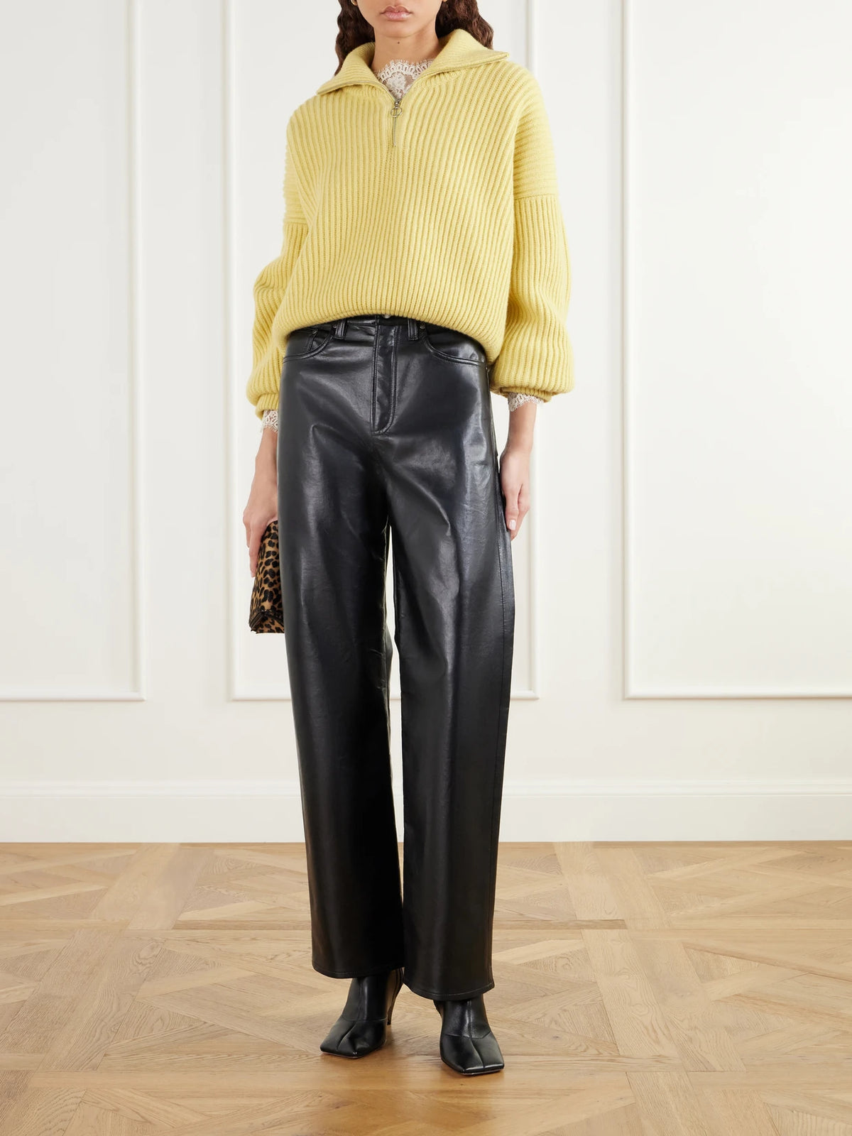 Image of a model wearing Pants. Product name - Verica Leather-blend High-rise Wide-leg Jeans in Black colour by brand - AGOLDE