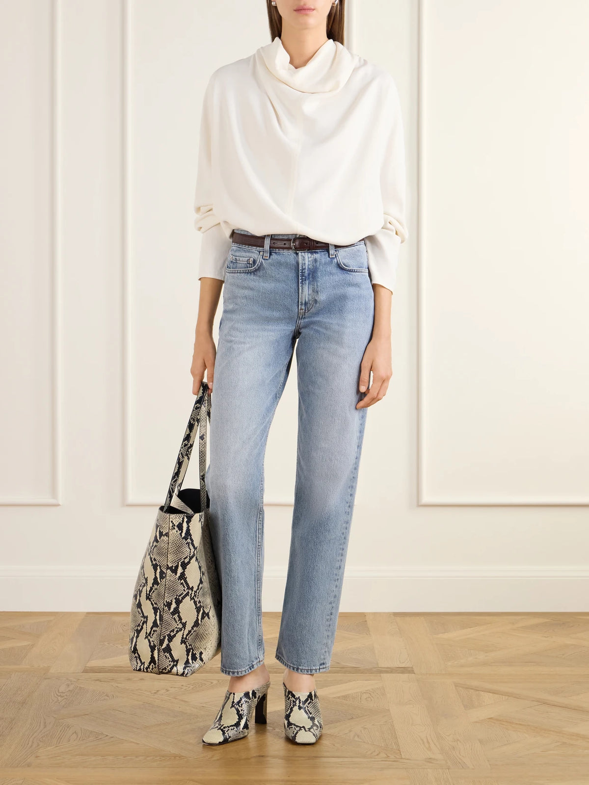 Image of a model wearing Tops. Product name - Draped Cady Blouse in Ecru colour by brand - TOTEME