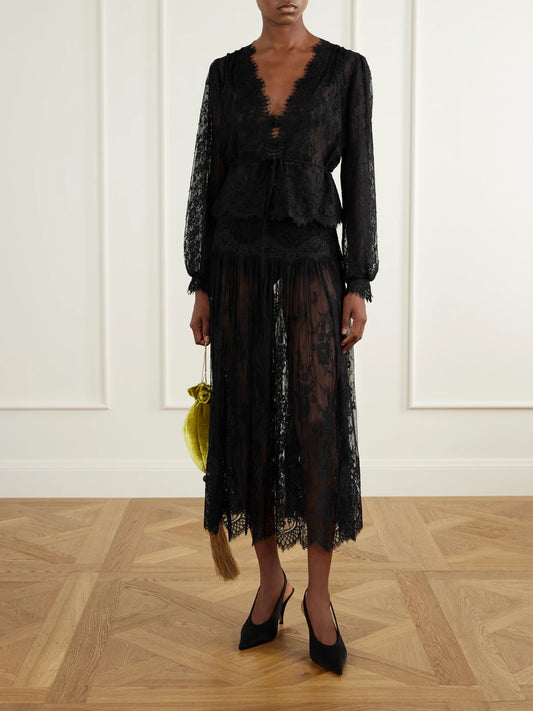 Image of a model wearing Skirts. Product name - Giorgine Scalloped Lace Midi Skirt in Black colour by brand - DÔEN