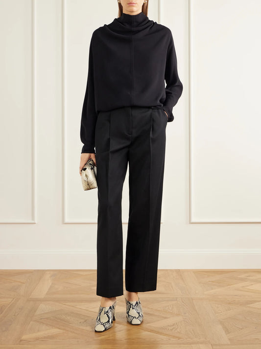 Image of a model wearing Tops. Product name - Draped Tie-detailed Satin Blouse in Black colour by brand - TOTEME
