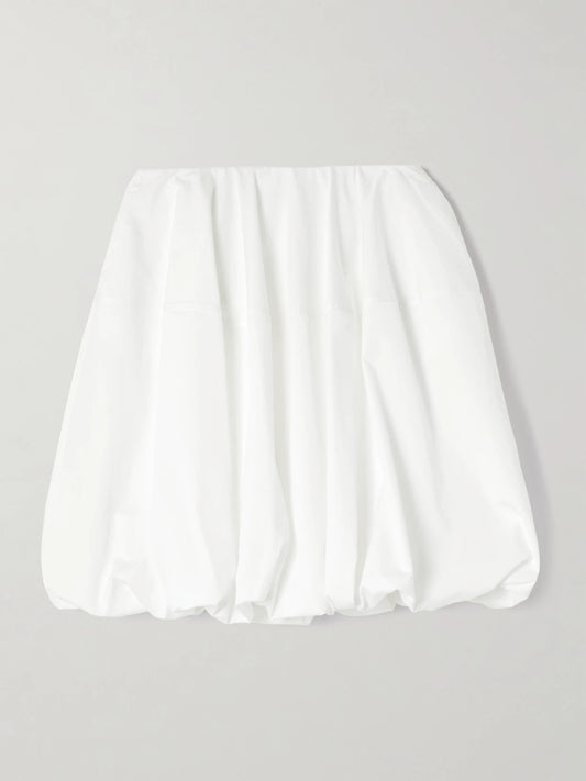 Image of a model wearing Skirts. Product name - Gathered Cotton-poplin Mini Skirt in White colour by brand - Alaïa