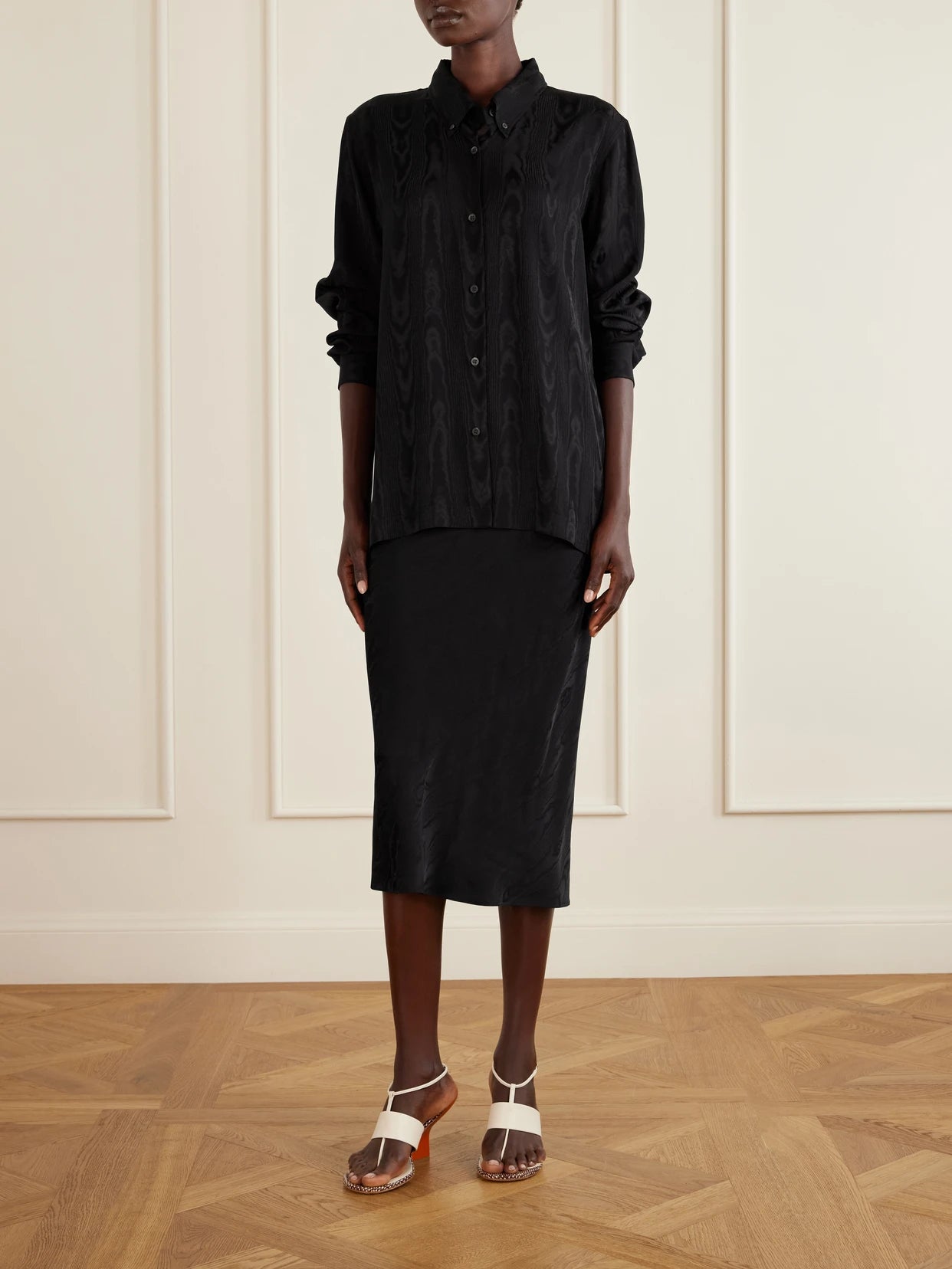 Image of a model wearing Tops. Product name - Moire Shirt in Black colour by brand - Dries Van Noten