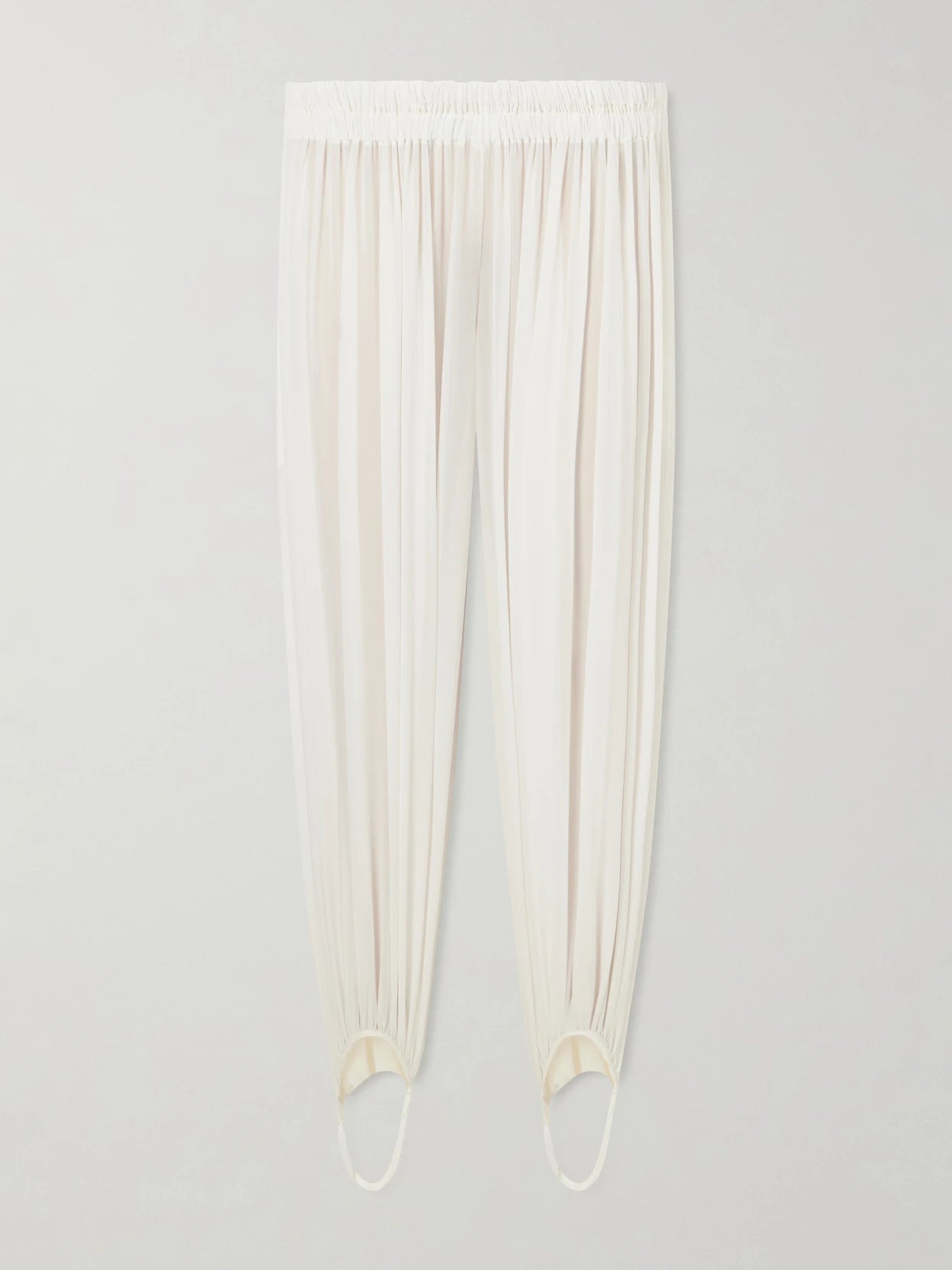 Image of a model wearing Pants. Product name - Shirred Silk-blend Georgette Balloon Pants in Off-white colour by brand - Alaïa
