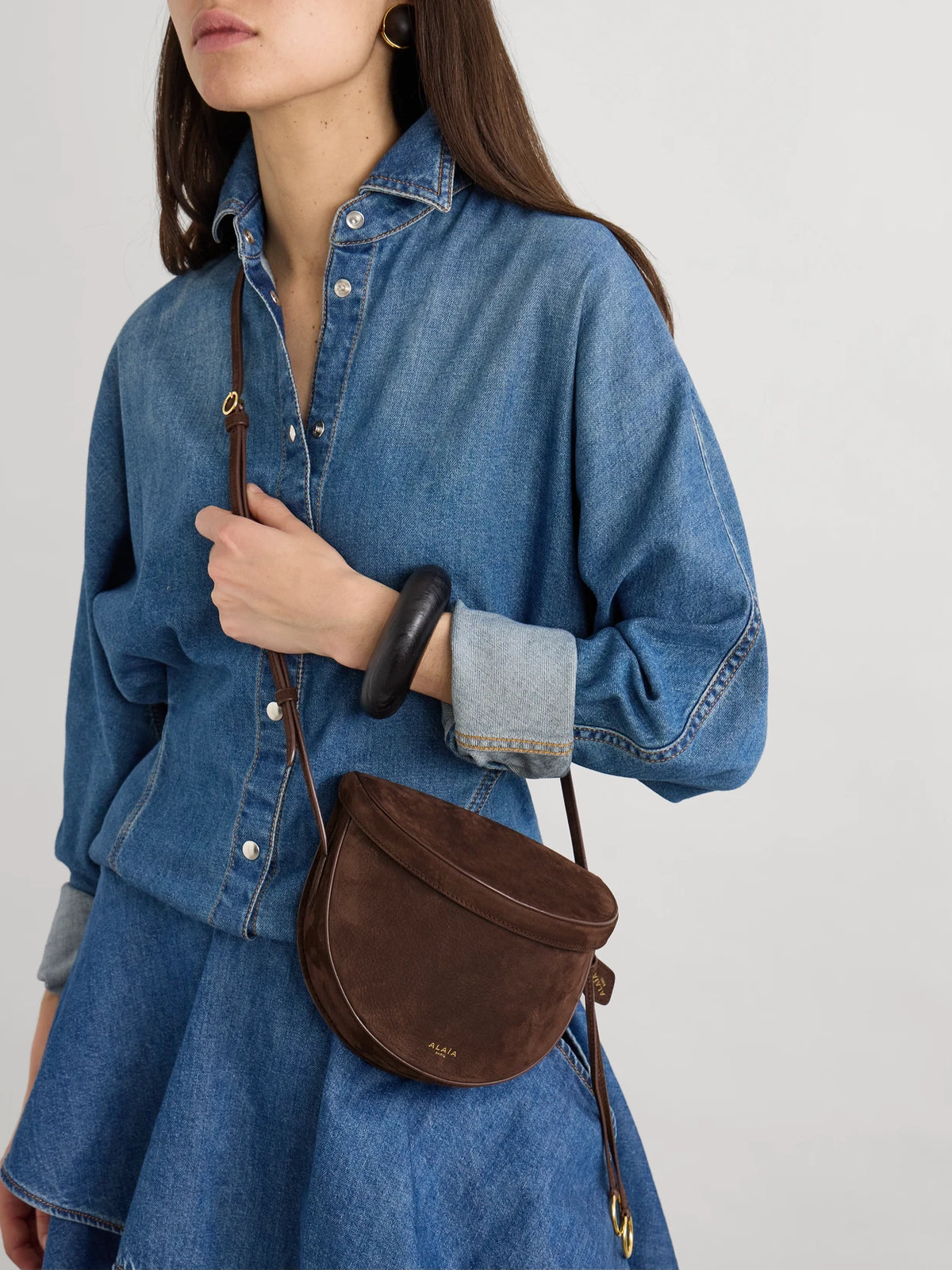 Image of Bags. Product name - Le Click Leather-trimmed Nubuck Shoulder Bag in Brown colour by brand - Alaïa