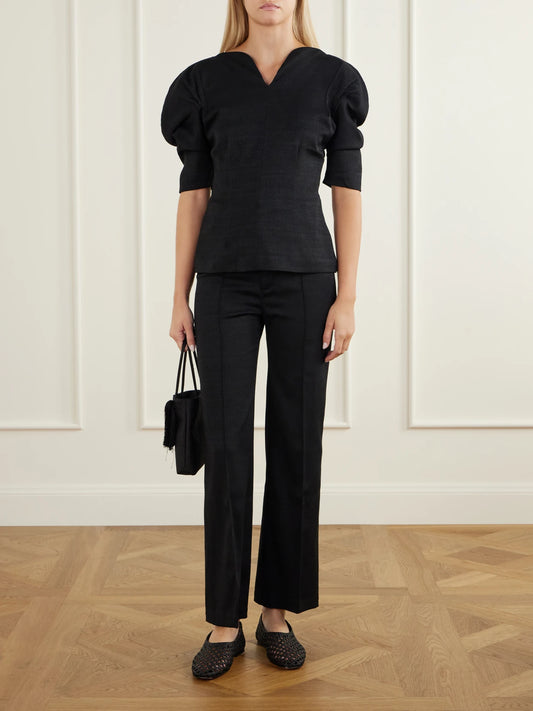 Image of a model wearing Tops. Product name - Janet Jacquard Blouse in Black colour by brand - DESTREE