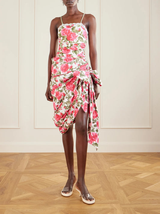 Image of a model wearing Skirts. Product name - Bow-detailed Ruched Floral-print Cotton-poplin Mini Skirt in White colour by brand - Chloé
