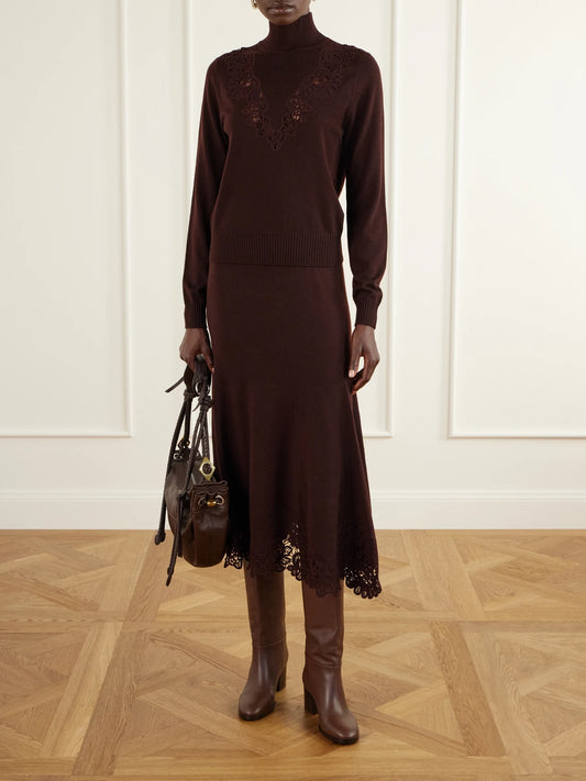Image of a model wearing Outerwear. Product name - Valiant Lace-trimmed Wool Turtleneck Sweater in Burgundy, Black colour by brand - Zimmermann