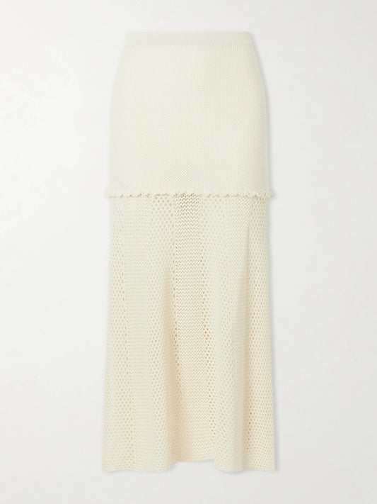 Image of a model wearing Skirts. Product name - Mural Crocheted Cotton Midi Skirt in Ivory colour by brand - ESCVDO