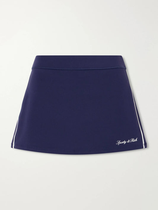 Image of a model wearing Tops. Product name - Striped Jersey Tennis Skirt in Navy colour by brand - Sporty & Rich
