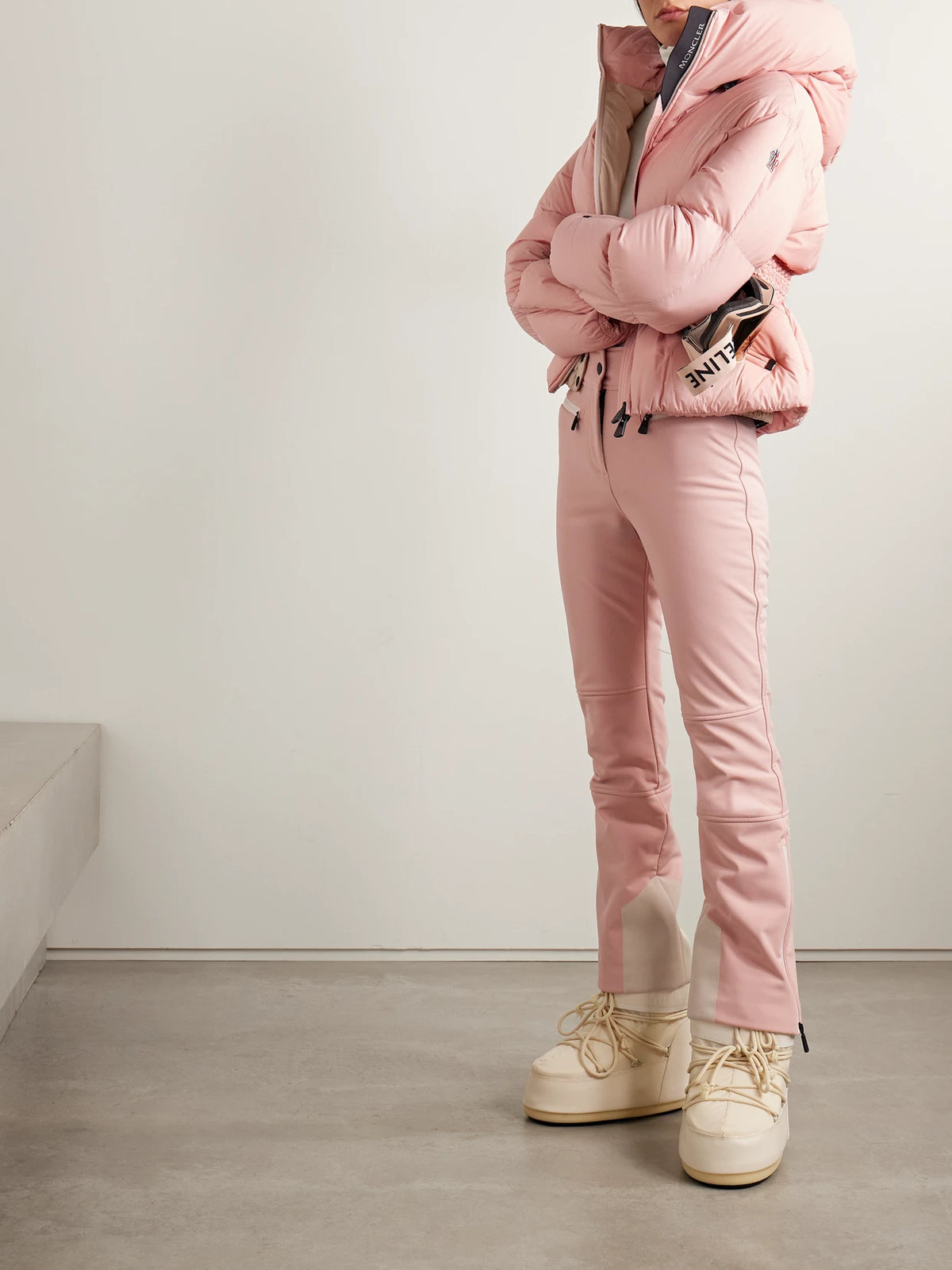 Image of a model wearing Pants. Product name - Paneled Bootcut Ski Pants in Baby pink colour by brand - Moncler Grenoble