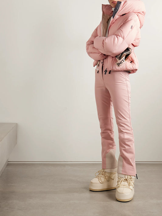 Image of a model wearing Pants. Product name - Paneled Bootcut Ski Pants in Baby pink colour by brand - Moncler Grenoble