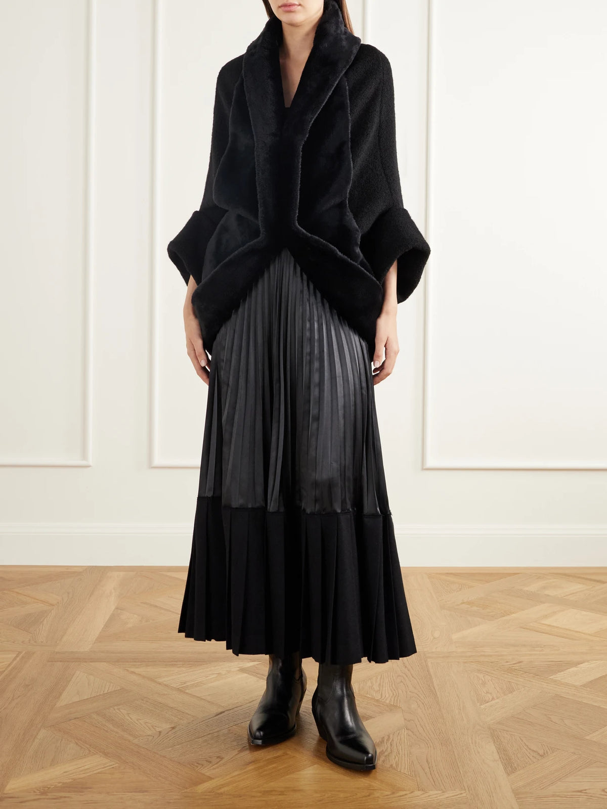 Image of a model wearing Skirts. Product name - Layered Pleated Wool-blend Flannel And Satin Maxi Skirt in Black colour by brand - Junya Watanabe