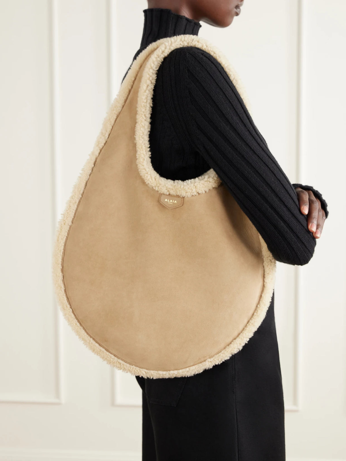 Image of Bags. Product name - One Piece Medium Merino Shearling Shoulder Bag in Camel colour by brand - Alaïa
