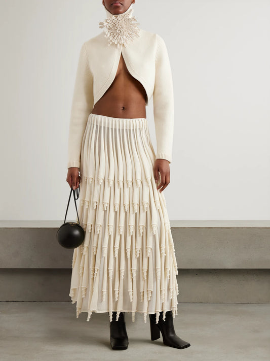 Image of a model wearing Outerwear. Product name - Cropped Cashmere-blend Turtleneck Sweater in Ivory colour by brand - Alaïa
