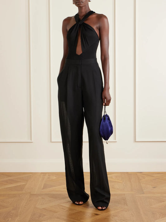 Image of a model wearing Tops. Product name - Rio Stretch-jersey Bodysuit in Black colour by brand - Ilkyaz Ozel
