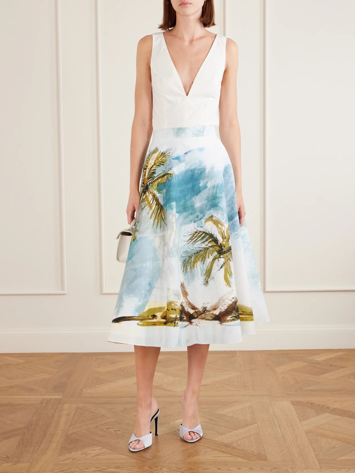 Image of a model wearing Skirts. Product name - All Over Beach Printed Cotton-blend Poplin Midi Skirt in Light blue colour by brand - Oscar de la Renta