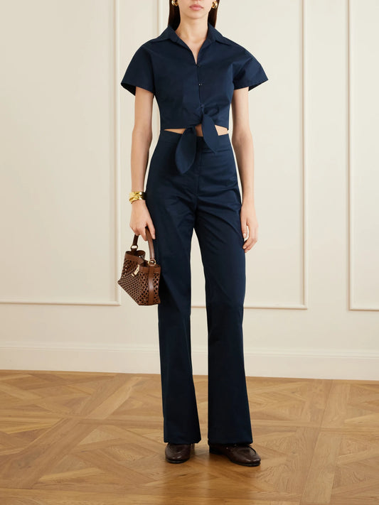 Image of a model wearing Tops. Product name - Tilda Cropped Tie-front Cotton-blend Shirt in Navy colour by brand - Giuliva Heritage
