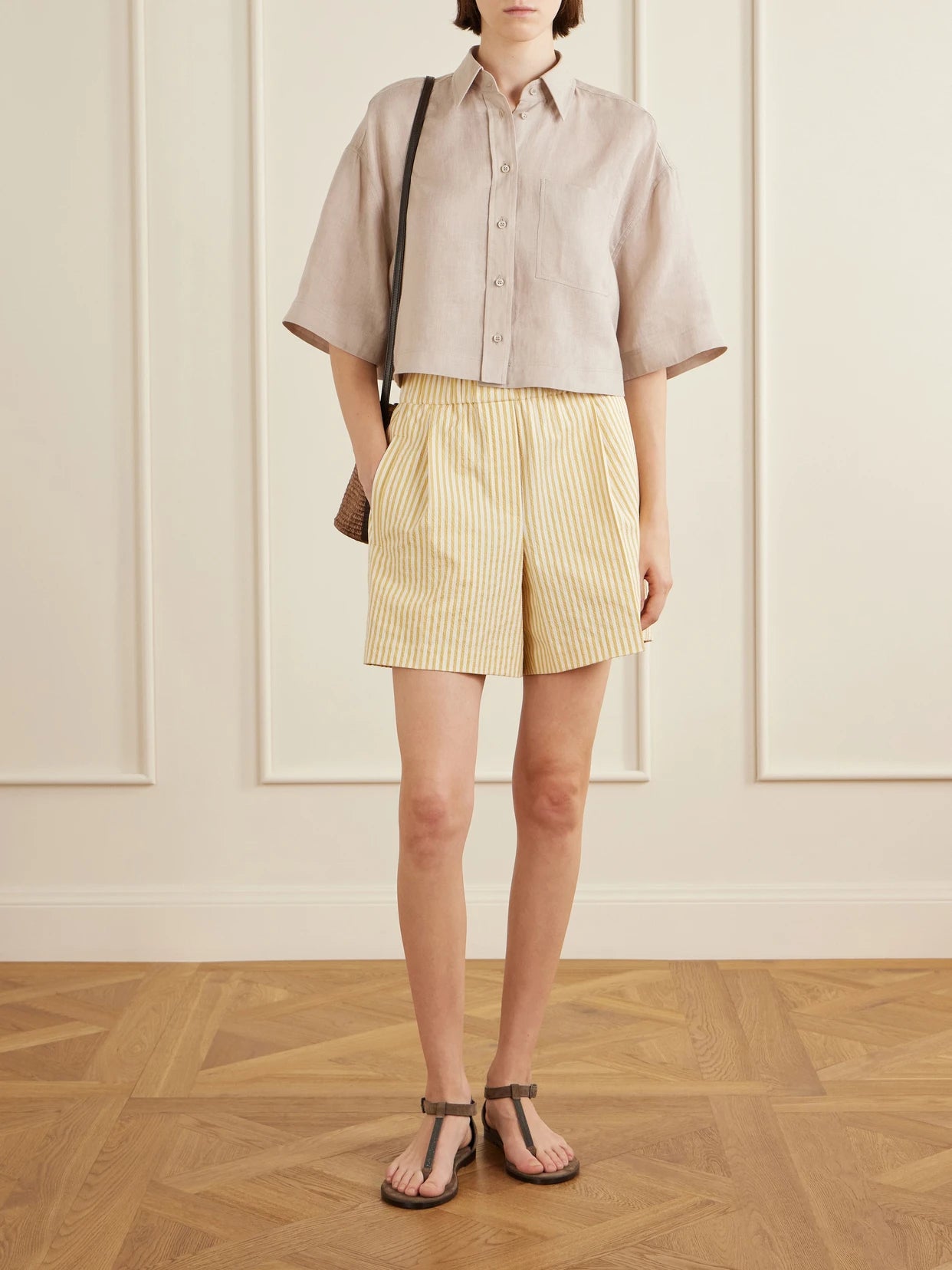 Image of a model wearing Shorts. Product name - Striped Cotton-blend Shorts in Sand colour by brand - Brunello Cucinelli