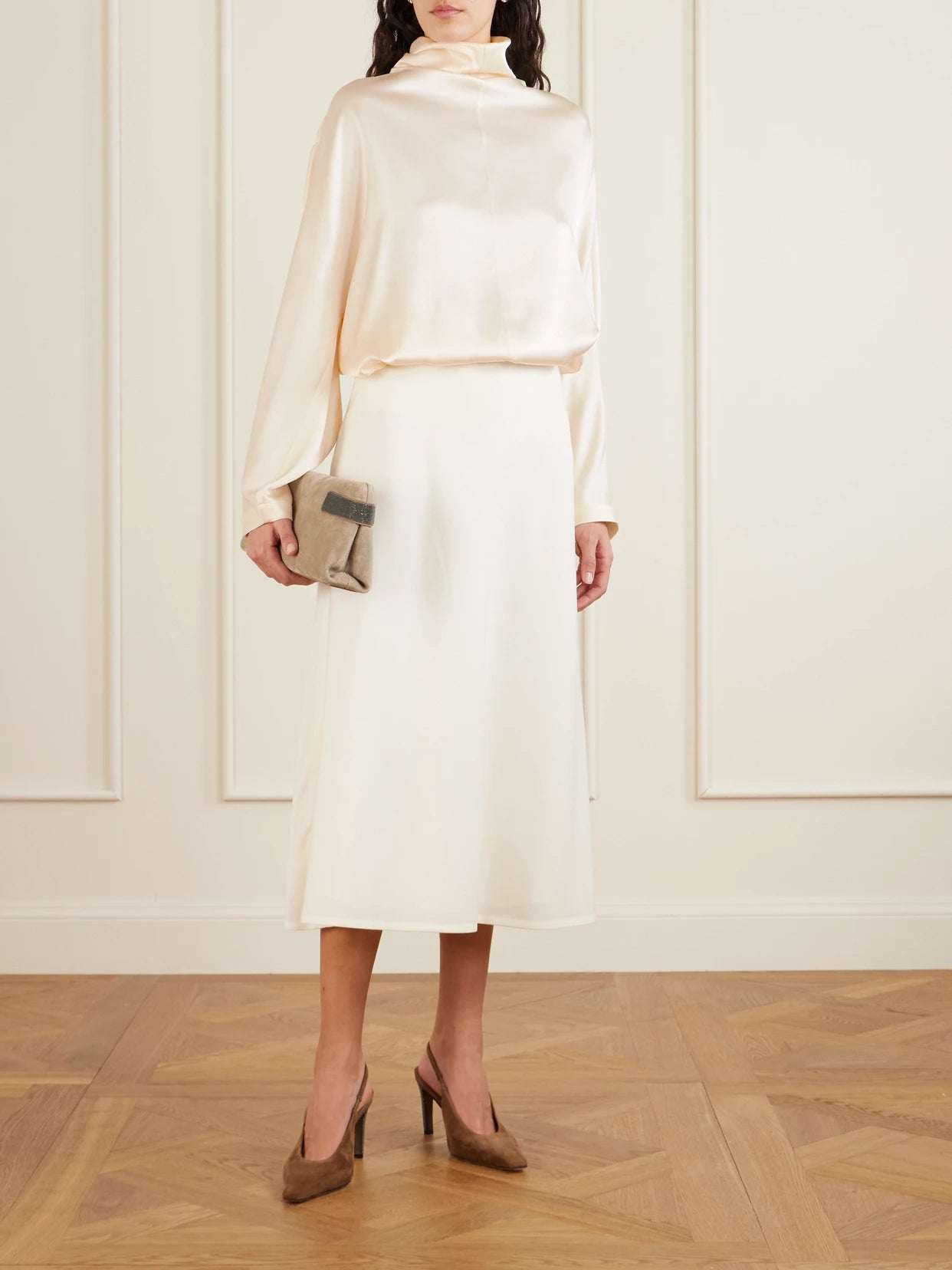Image of a model wearing Tops. Product name - Silk-satin Turtleneck Blouse in Ivory colour by brand - Brunello Cucinelli