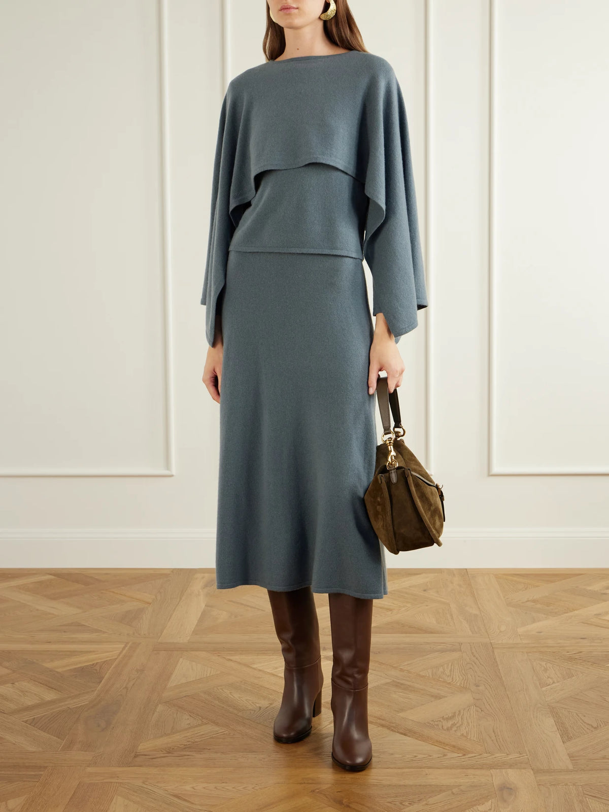 Image of a model wearing Skirts. Product name - Valiant Wool And Cashmere-blend Knitted Midi Skirt in Blue colour by brand - Zimmermann