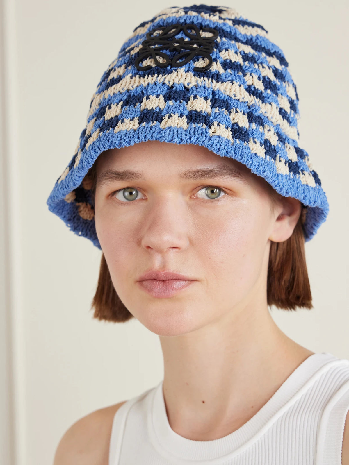 Image of Hats. Product name - + Paula's Ibiza Anagram Appliquéd Crocheted Paper-blend Bucket Hat in Navy colour by brand - LOEWE