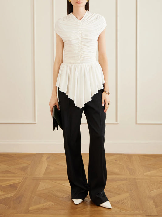 Image of a model wearing Tops. Product name - Gabor Ruched Ruffled Stretch-jersey Blouse in Pastel yellow colour by brand - TOVE