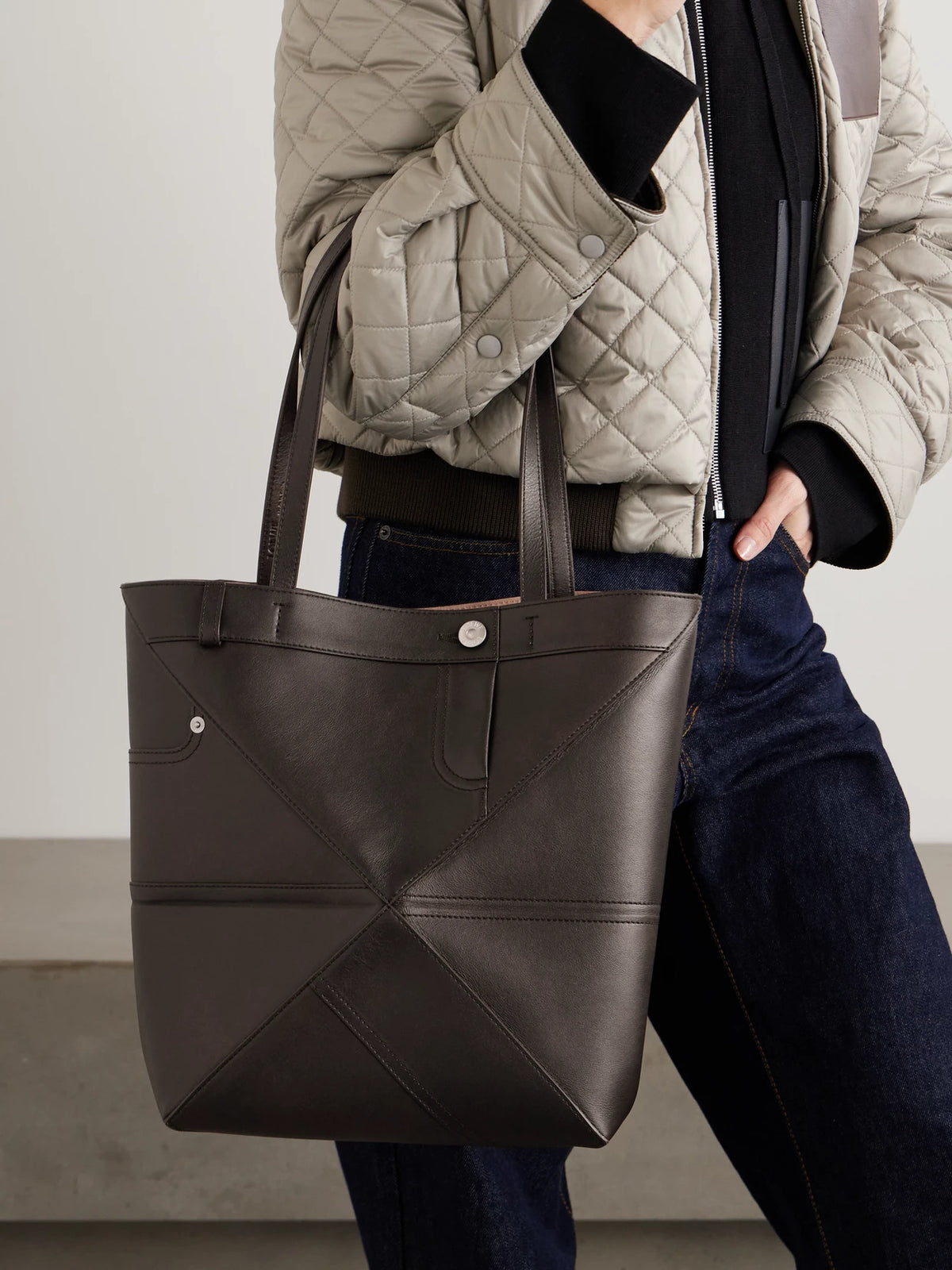 Image of Bags. Product name - Puzzle Fold Panta Medium Convertible Leather Tote in Dark brown colour by brand - LOEWE