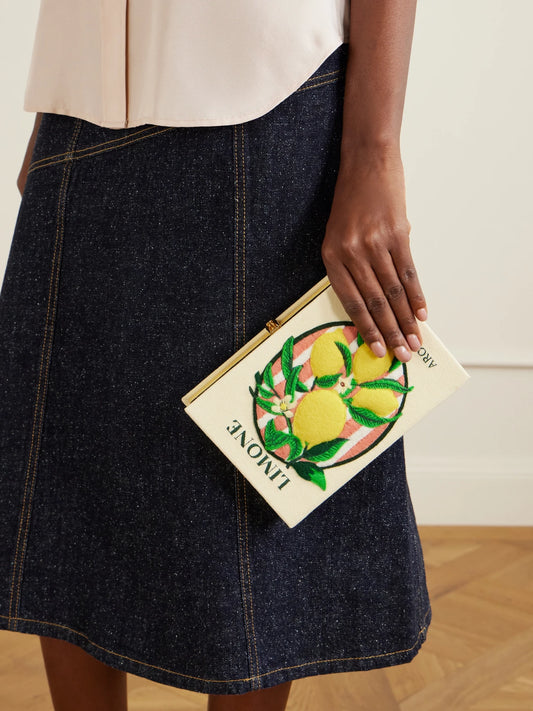 Image of Bags. Product name - Aroma D'italia Appliquéd Embroidered Canvas Clutch in Yellow colour by brand - Olympia Le-Tan