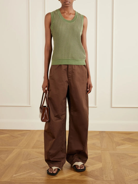 Image of a model wearing Pants. Product name - Garment-dyed Cotton-blend Gabardine Wide-leg Pants in Brown colour by brand - Tibi