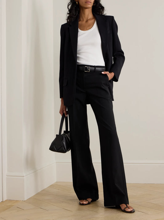 Image of a model wearing Pants. Product name - Morissey Pleated Stretch-wool Twill Straight-leg Pants in Black colour by brand - Joseph