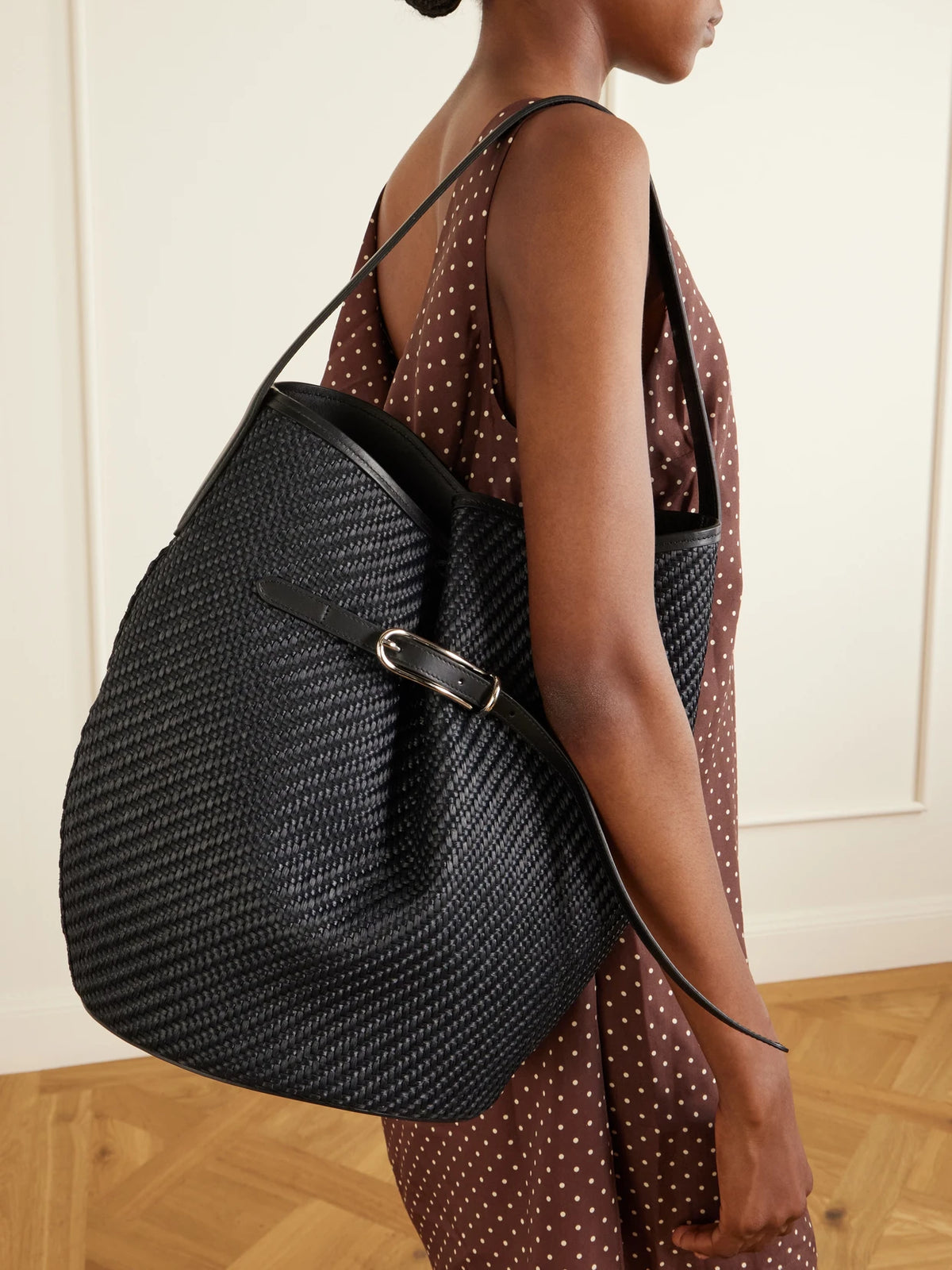 Image of Bags. Product name - Belted Bucket Leather-trimmed Raffia Bucket Bag in Black colour by brand - Liffner