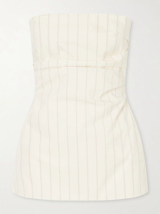 Image of a model wearing Tops. Product name - Strapless Pinstriped Cotton-blend Poplin Top in Ecru colour by brand - ST. AGNI