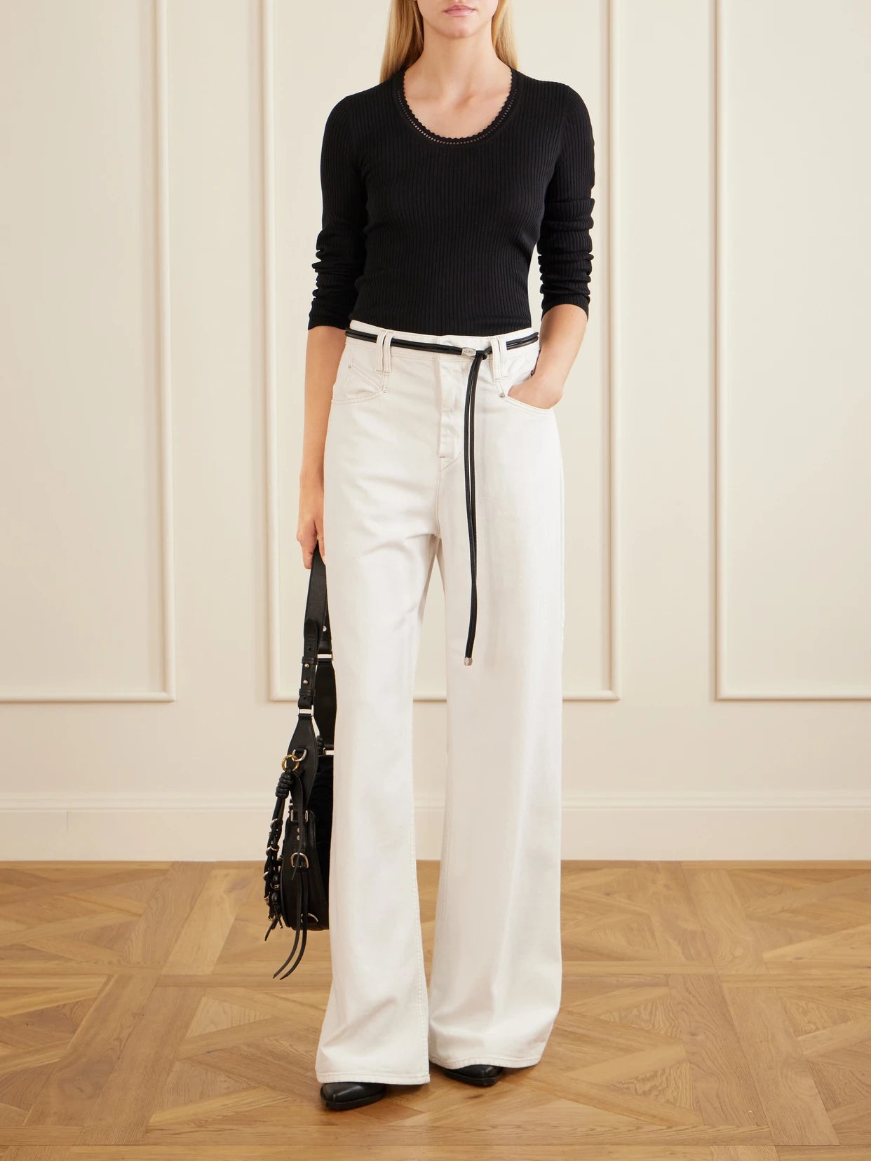 Image of a model wearing Outerwear. Product name - Selenie Scalloped Ribbed Silk And Cotton-blend Sweater in Black colour by brand - ISABEL MARANT