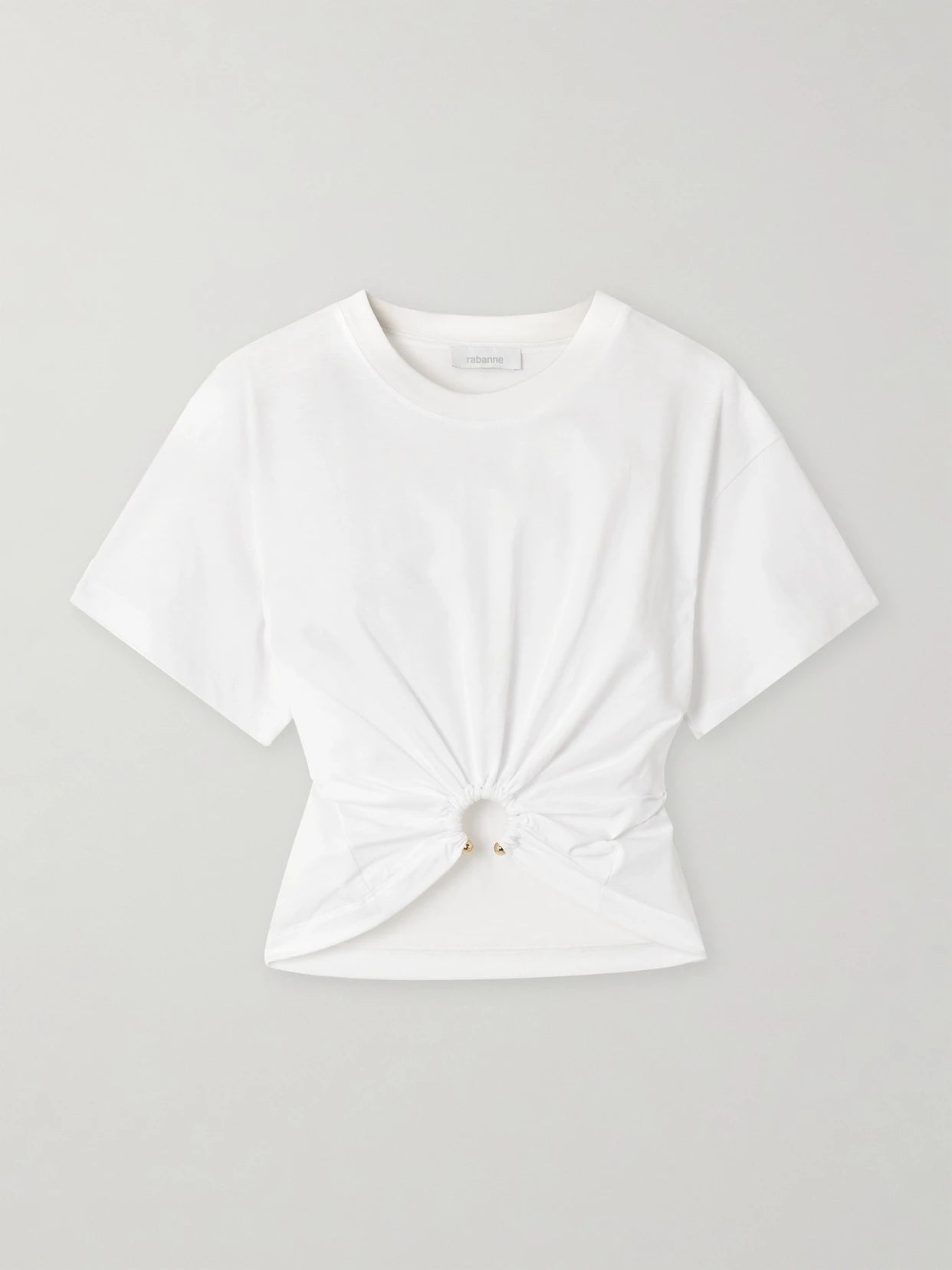 Image of a model wearing Tops. Product name - Cropped Embellished Gathered Cotton-jersey T-shirt in White colour by brand - RABANNE