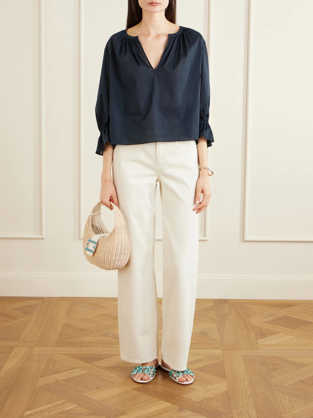 Image of a model wearing Tops. Product name - Poet Cotton Blouse in Navy colour by brand - FRAME