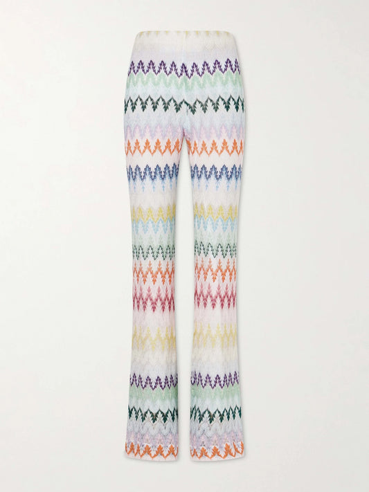 Image of a model wearing Pants. Product name - Striped Metallic Crochet-knit Flared Pants in White colour by brand - Missoni