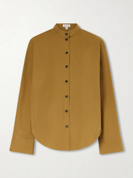 Image of a model wearing Tops. Product name - Oversized Cotton-poplin Shirt in Brown colour by brand - Alaïa
