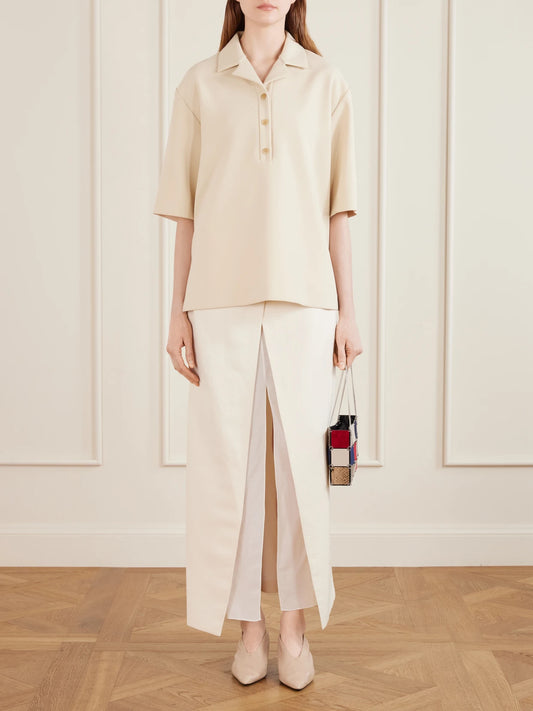Image of a model wearing Tops. Product name - Loucin Naia-blend Crepe T-shirt in Ivory colour by brand - KHAITE